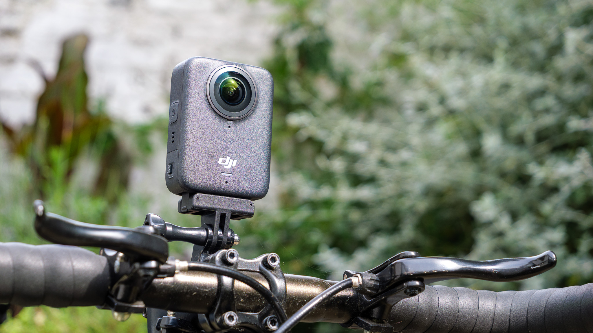 DJI Osmo 360 camera mounted on bicycle handlebars