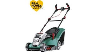 Green lawn mower on white background with yellow heart graphic and test Real Homes loves