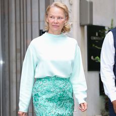 Pamela Anderson wears a Strathberry Mosaic Handbag