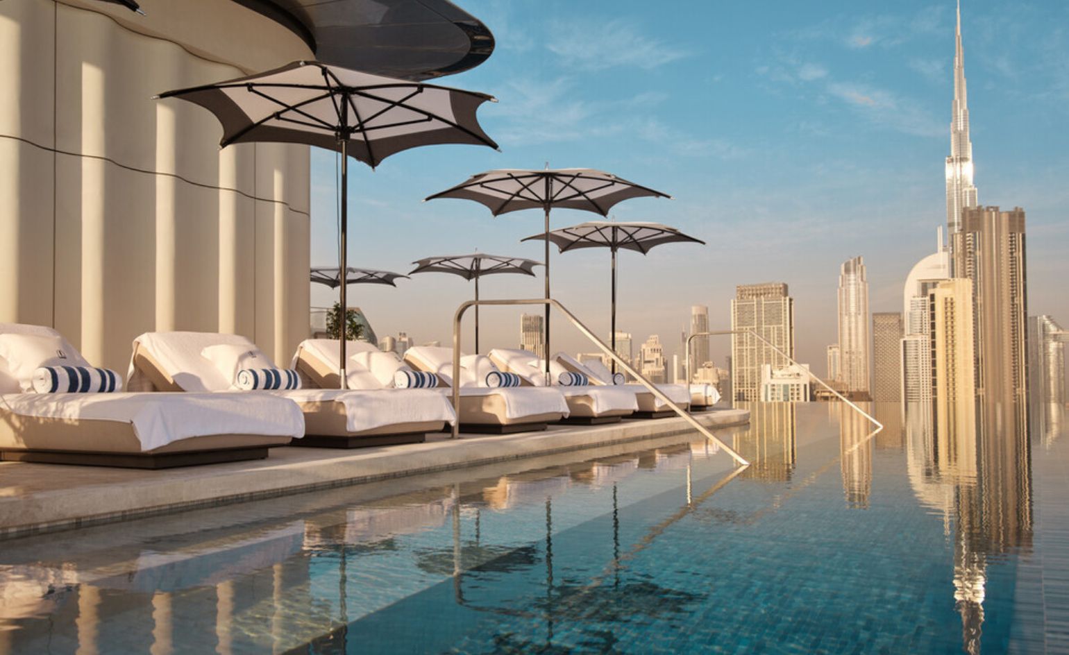 hotel pool and Dubai skyline