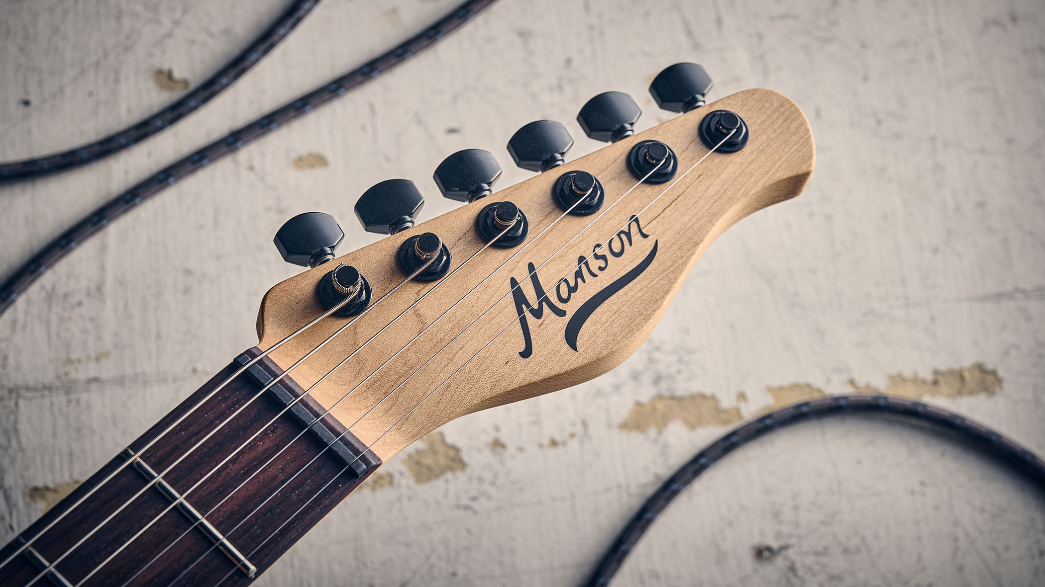 Manson MD-3 Mikey Demus Signature: the hot-orange T-style is photographed against a distressed grey-white background