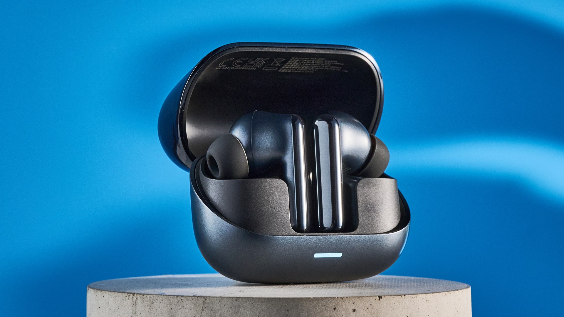 A pair of black Honor Earbuds 4 wireless earbuds
