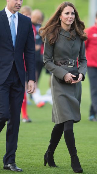 Kate Middleton s knee high boots and olive green coat are style staples Woman Home