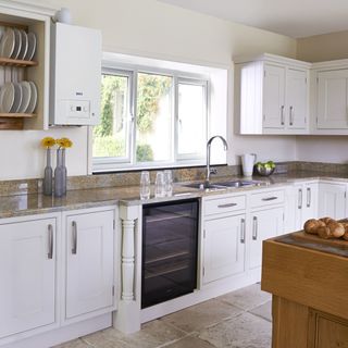 kitchen room with kitchen cabinets and shelves on wall