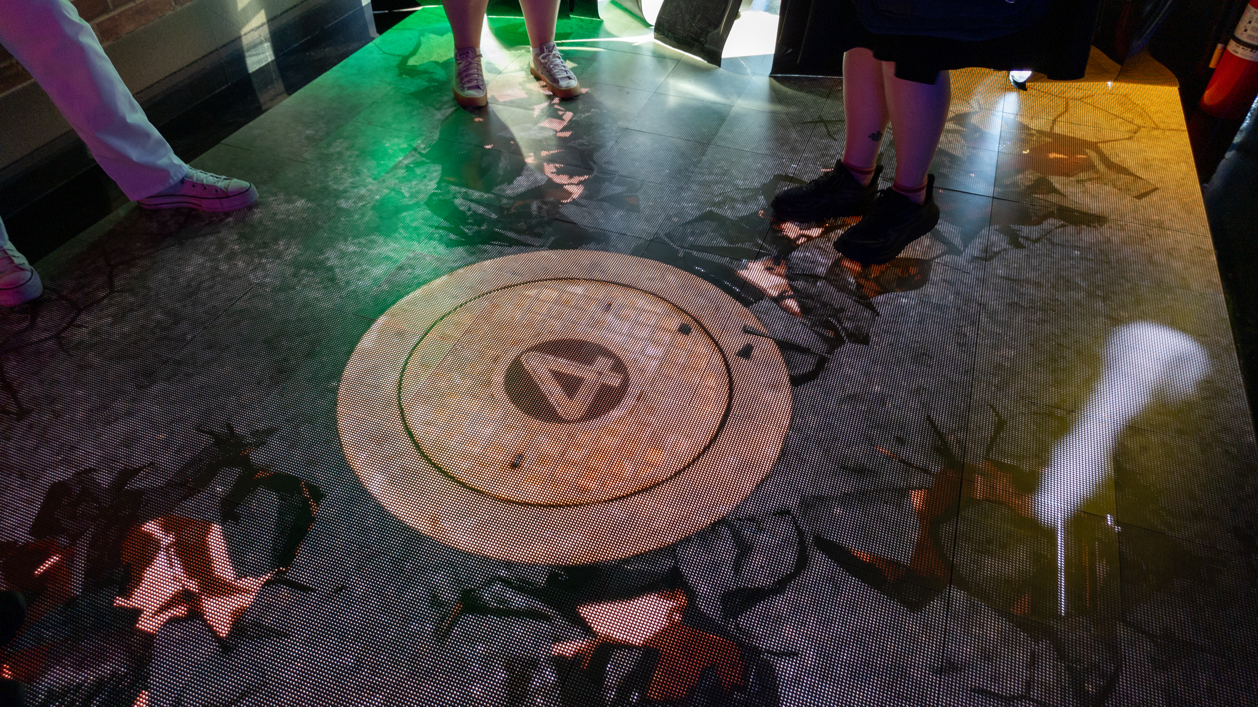 A digital floor displaying a crumpling floor at Google's San Diego Comic-Con Rewards Lab