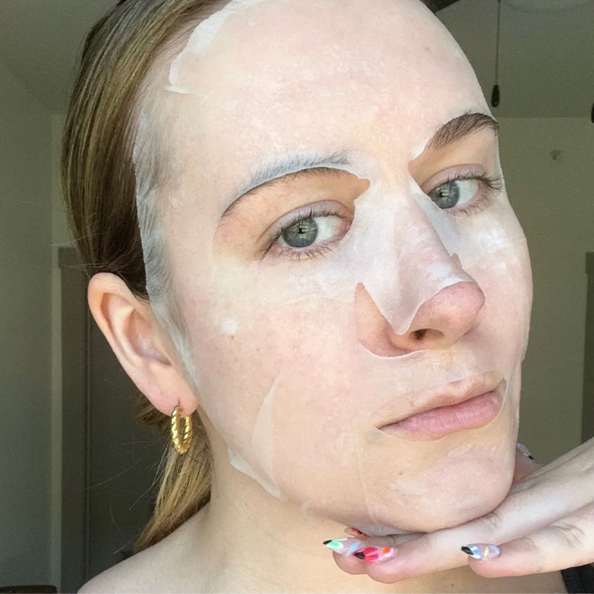 A woman wearing a face mask.