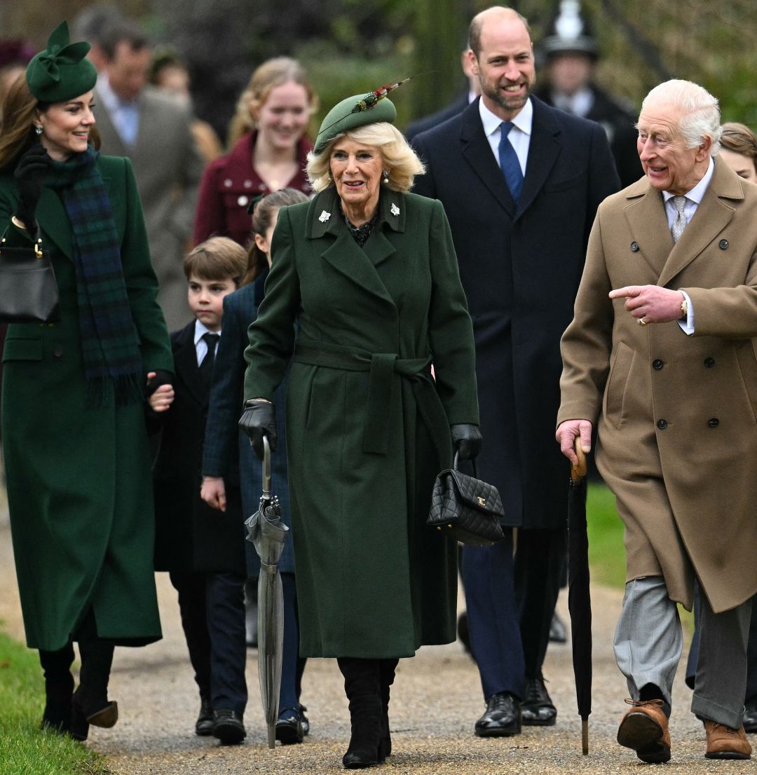 King Charles, Queen Camilla and the Royal Family walking to church on Christmas day wearing long coats and hats