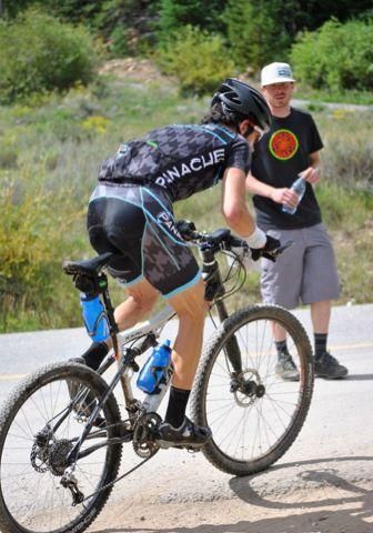 Colby Pearce stands up out of aid station #2.