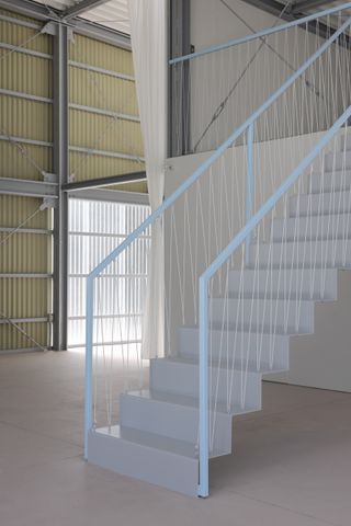 stairs inside arii irie's Warehouse Villa in Isumi