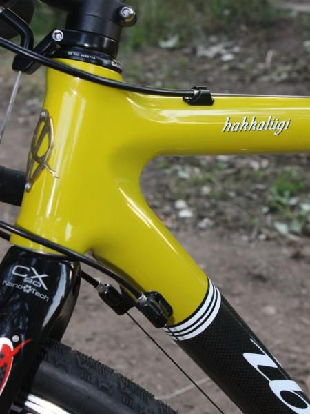 Handy barrel adjusters are incorporated into housing stops though it'd be nice if the derailleur cables laid a bit closer to the down tube when picking the bike up for run-ups.