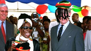 The Prince of Wales is presented with a Rasta Cap by Bob Marley's widow Rita, at Trenchtown community centre in Kingston, Jamaica , on February 29, 2000 in Kingston, Jamaica.