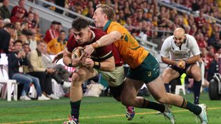 Dan Sheehan of British and Irish Lions goes over to score his team's 3rd try despite the efforts of Harry Potter of Australia during the 1st Test Match between Australia Wallabies