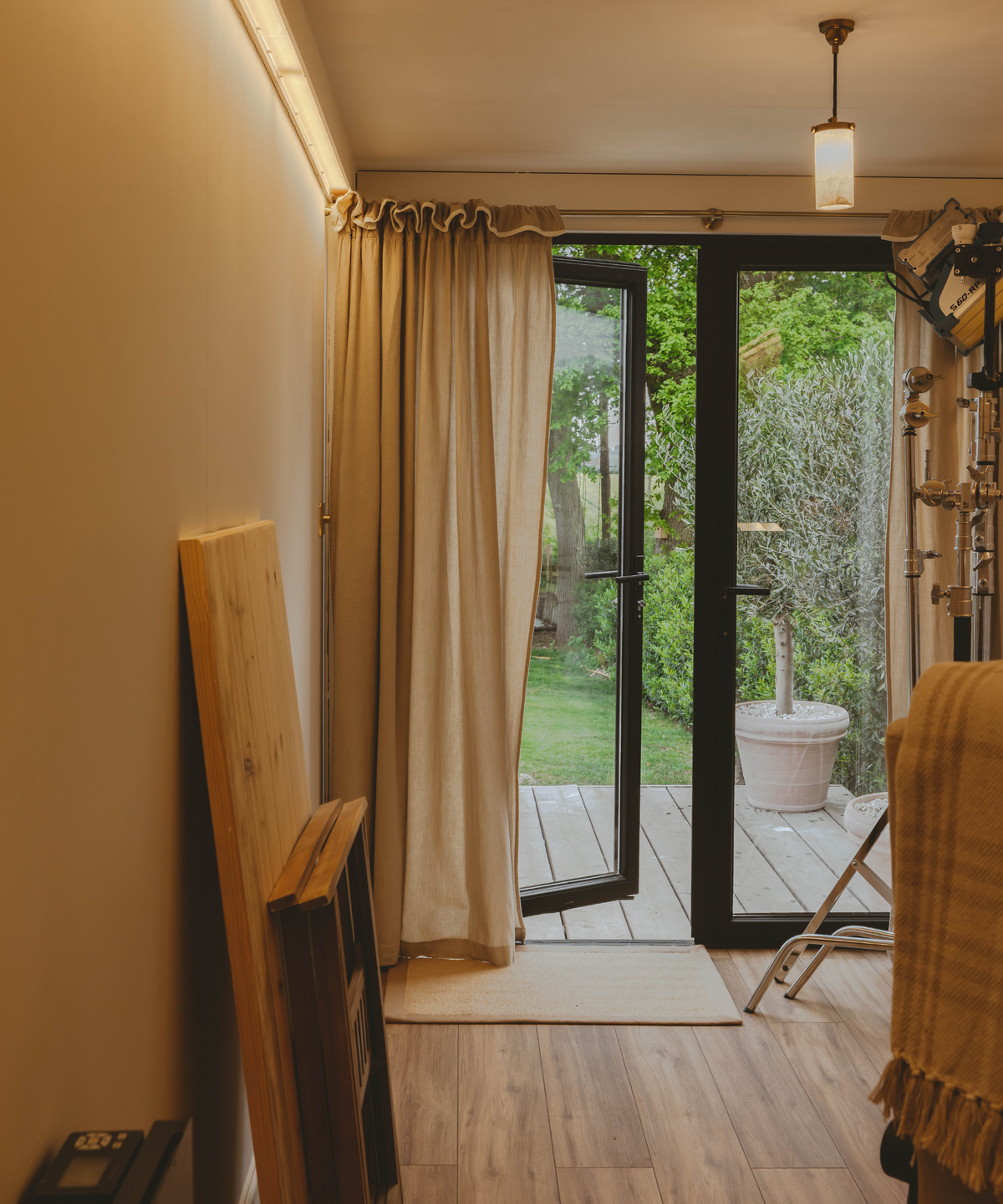 Patio doors open in shipping container with curtain