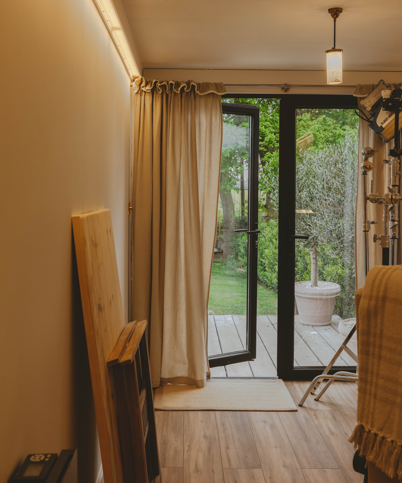 Patio doors open in shipping container with curtain
