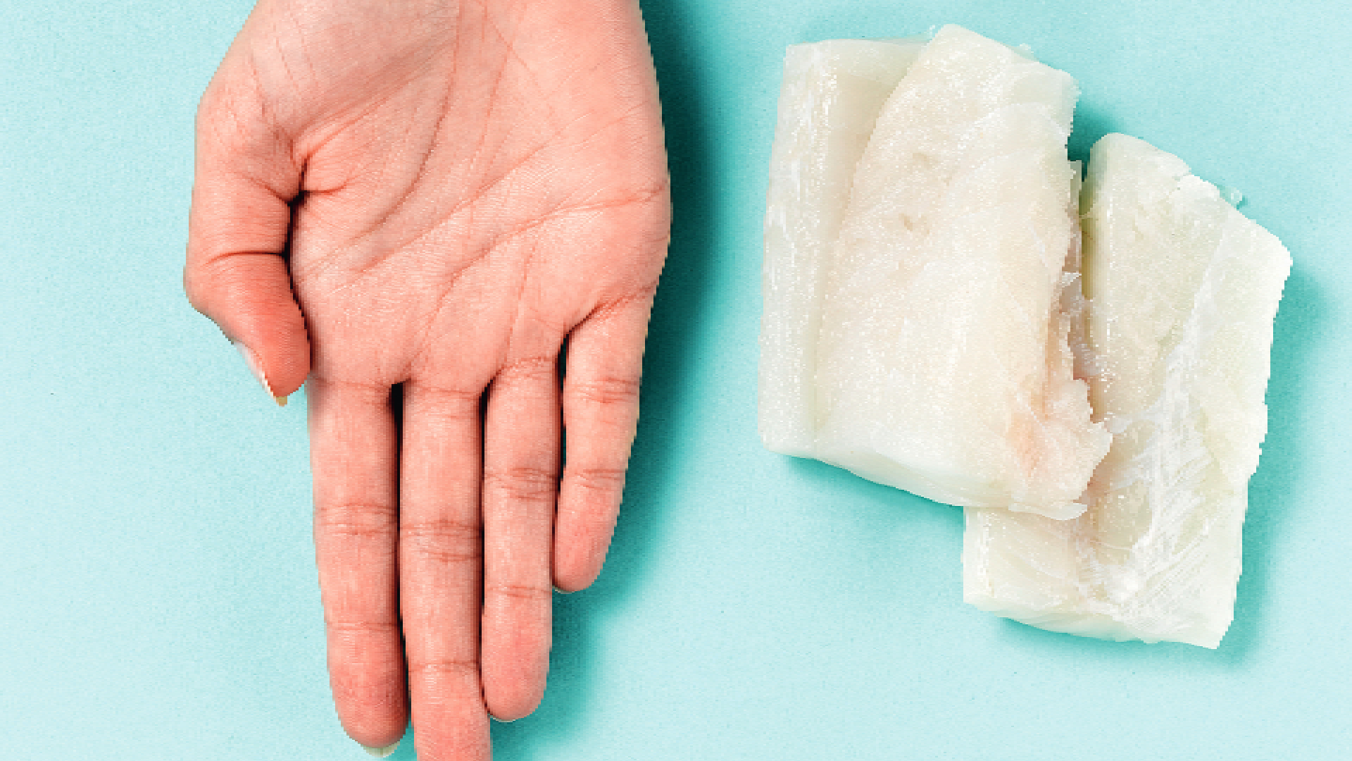 palm next to white fish