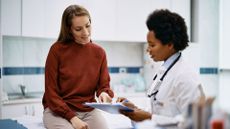 Woman in menopause health check with doctor