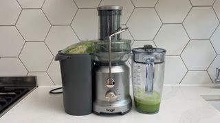 Breville the Juice Fountain Cold filled with green juice