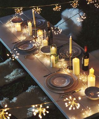 Festive outdoor dining with starburst chain lights