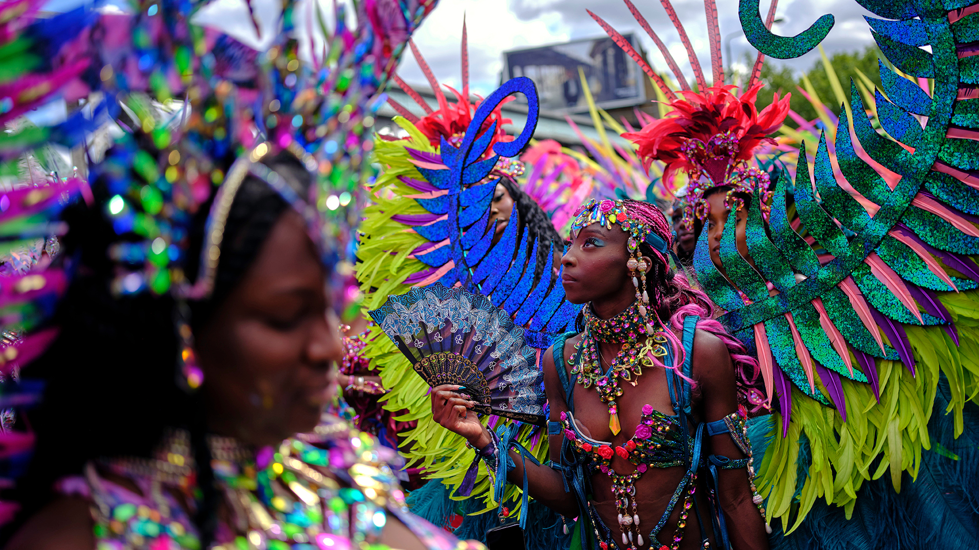 Costumed revelers celebrate the Notting Hill Carnival in London, United Kingdom