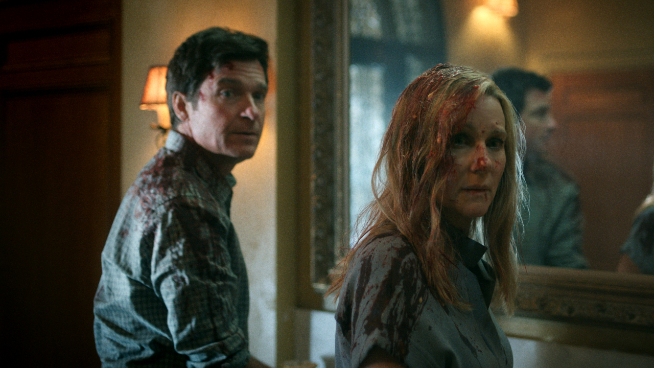 Jason Bateman and Laura Linney stand bloodied in front of a mirror in Ozark.