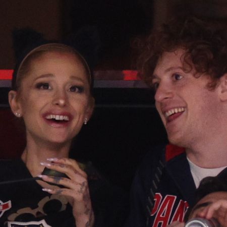 Ariana Grande and Ethan Slater laugh while wearing game shirts during Game One of the 2024 Stanley Cup Final between the Florida Panthers and the Edmonton Oilers in Florida on June 08, 2024