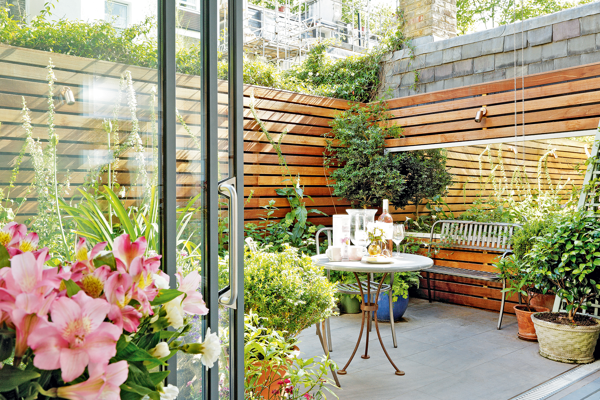City balcony / terrace with a bistro table and alarge mirror