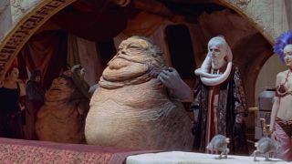 Jabba and Gardulla the Hutt arrive at their race box in Star Wars: The Phantom Menace.