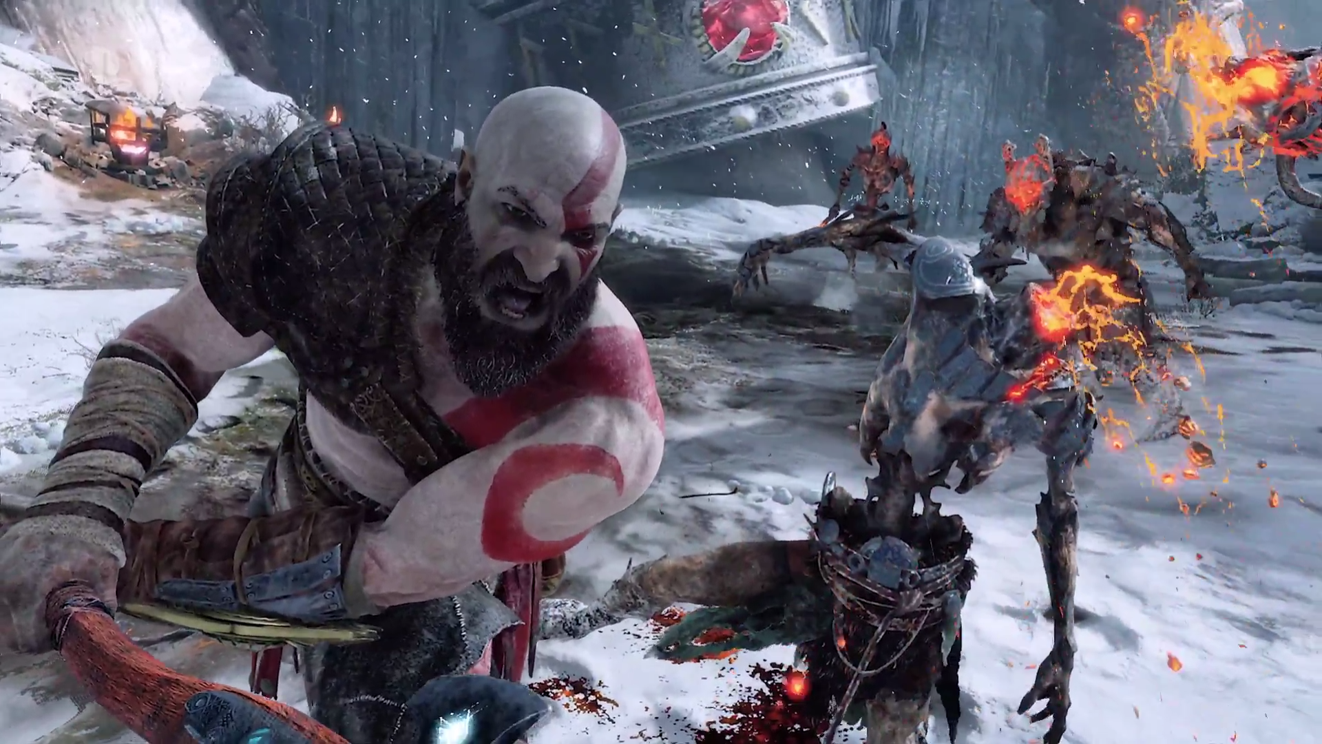 God of War Kratos slashing an enemy with his axe