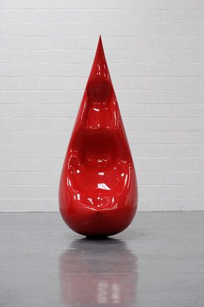 A red tear drop shaped object.