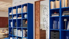 a bright blue bookcase with decor on it from IKEA