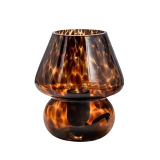 A glass mushroom lamp with a black and brown pattern