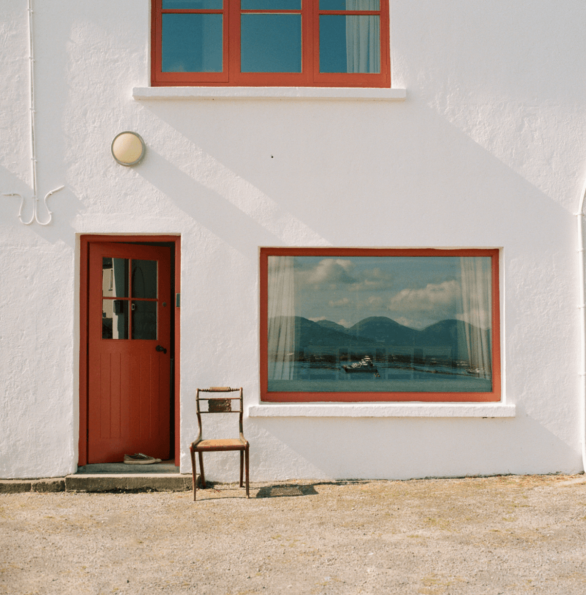 A forest hotel stay boasts minimalist exterior that have it disappear into the surrounding nature, while a seaside one features white-washed walls and terracotta red-painted fixtures.