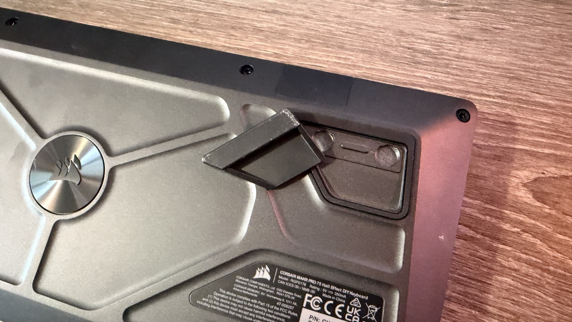 Corsair Makr Pro 75 gaming keyboard on a wooden desk