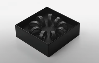 The Samsung Galasxy Ring sizing kit: A black box with nine plastic rings in it, each with a number on them to illustrate the ring size.