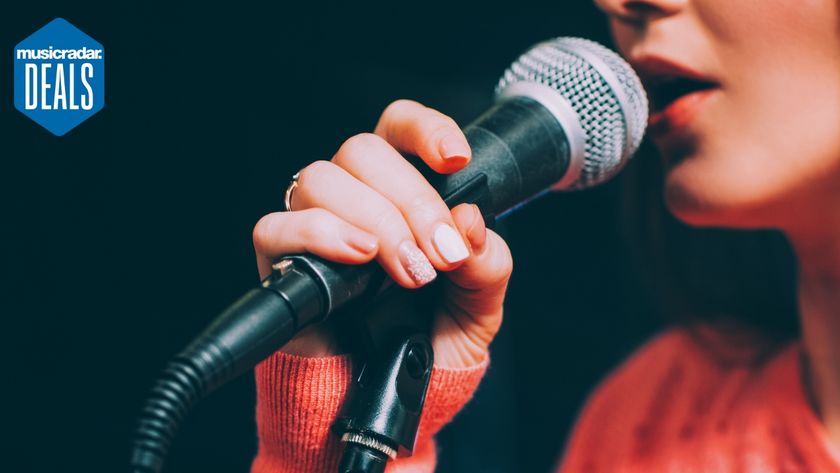 A woman sings into a microphone