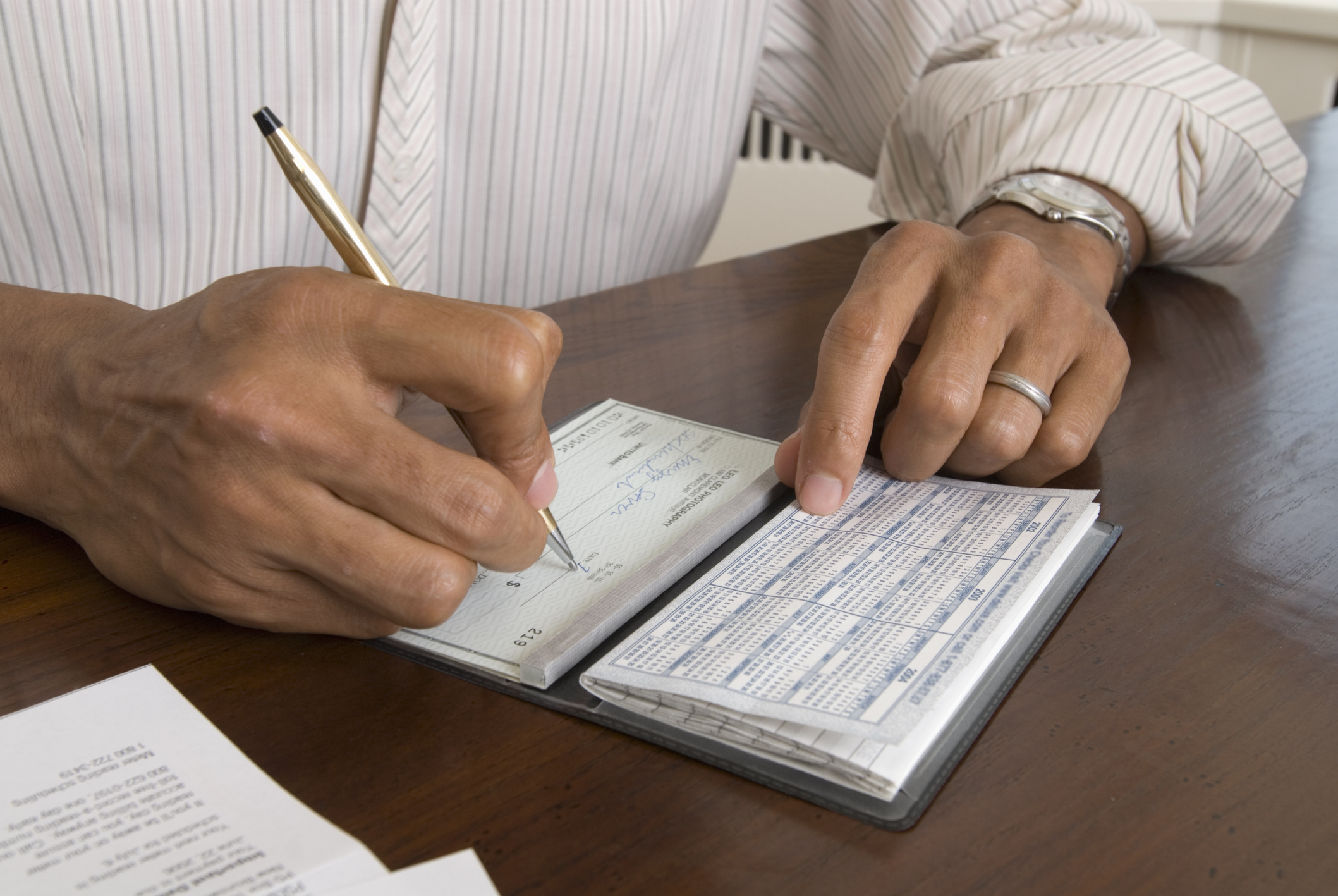 Man writing a cheque