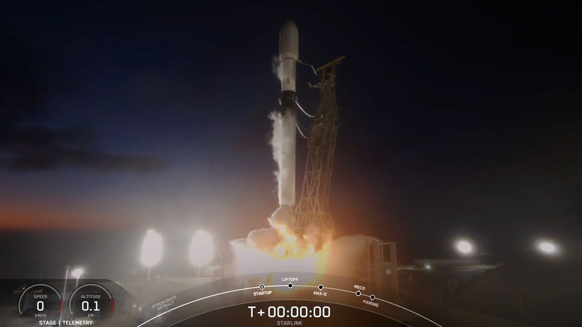 a black and white spacex rocket launches into a night sky