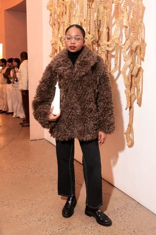 Attendee at an event celebrating the White Lotus x Banana Republic collab.