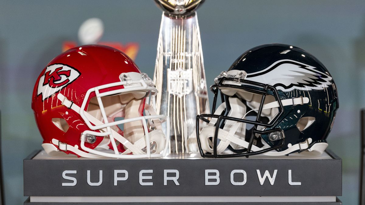 NEW ORLEANS, LOUISIANA - FEBRUARY 03: A detail shot of the Lombardi Trophy next to Kansas City Chiefs and Philadelphia Eagles helmets prior to a news conference on February 03, 2025 in New Orleans, Louisiana ahead of the NFL Super Bowl LIX football game between the Philadelphia Eagles and the Kansas City Chiefs