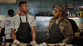 Mamoudou Athie as Elijah and Courtney B. Vance as Louis in Uncorked on Netflix