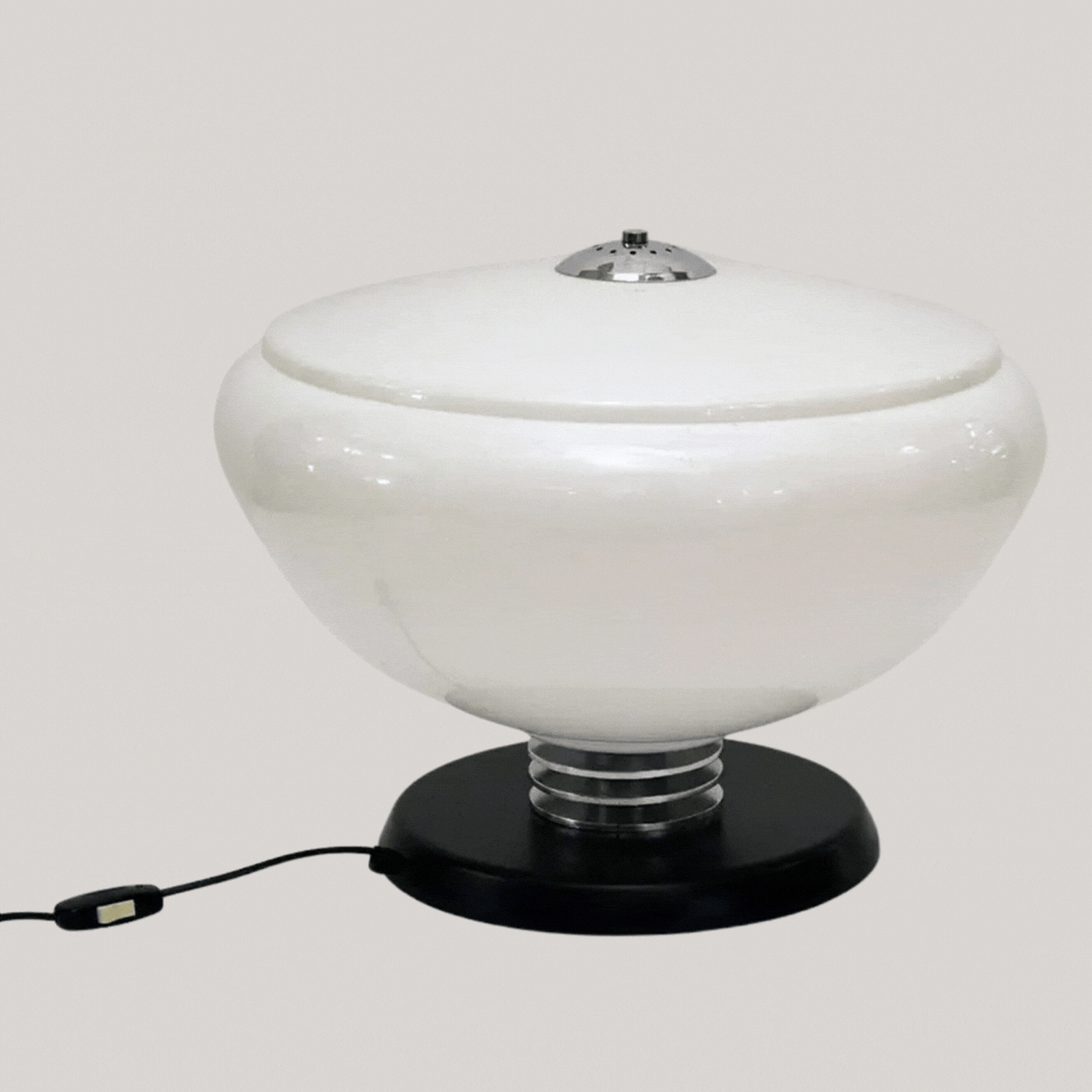 Large Table Lamp Attributed to Guzzini, 1970s against pale gray background, captured in a gif showing it on and off.