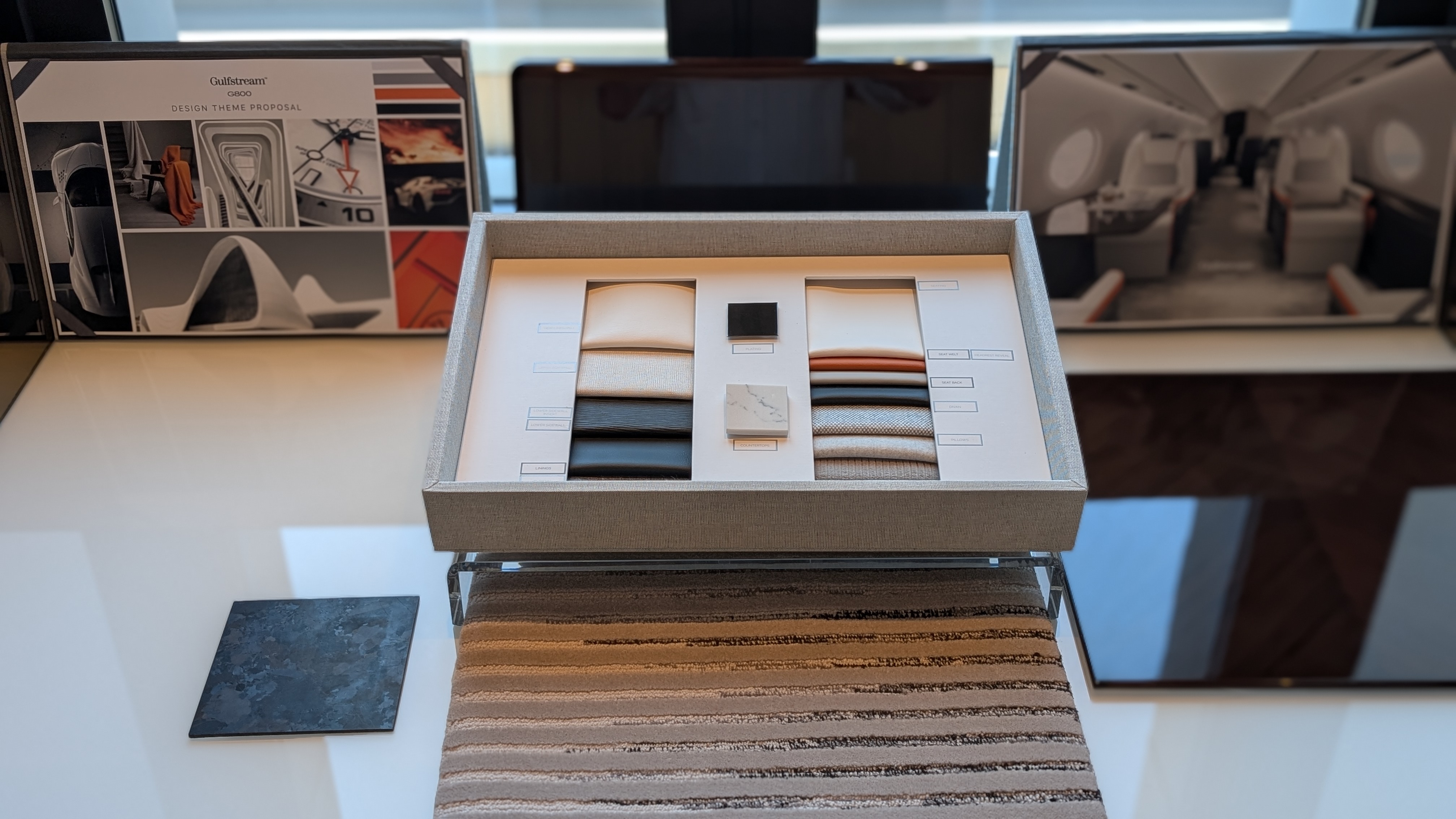 The design studio includes copious swatches of fabric and materials