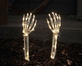 light-up skeleton hands in garden from Lights4fun