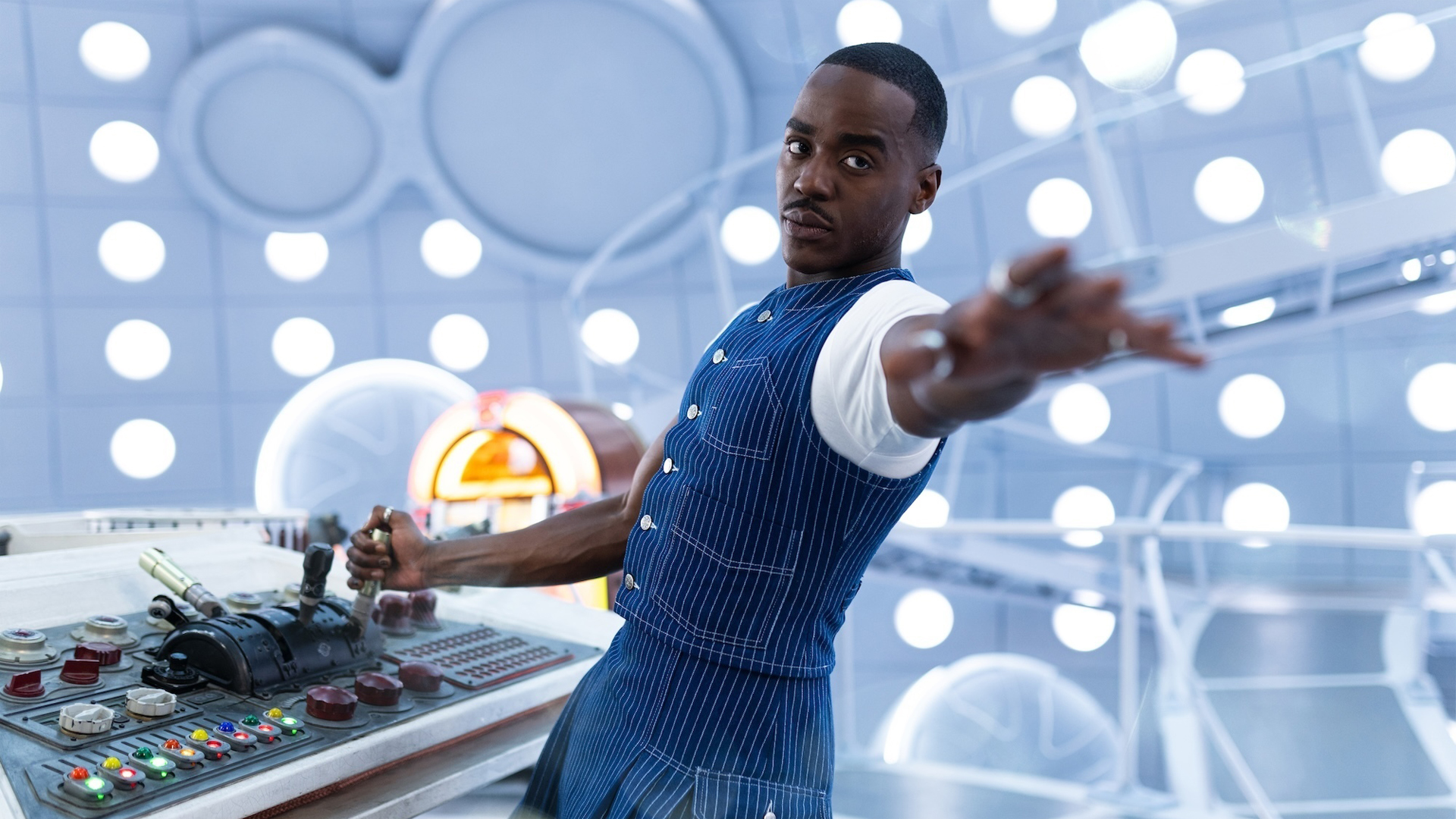 The Fifteenth Doctor leaning backwards from the TARDIS console