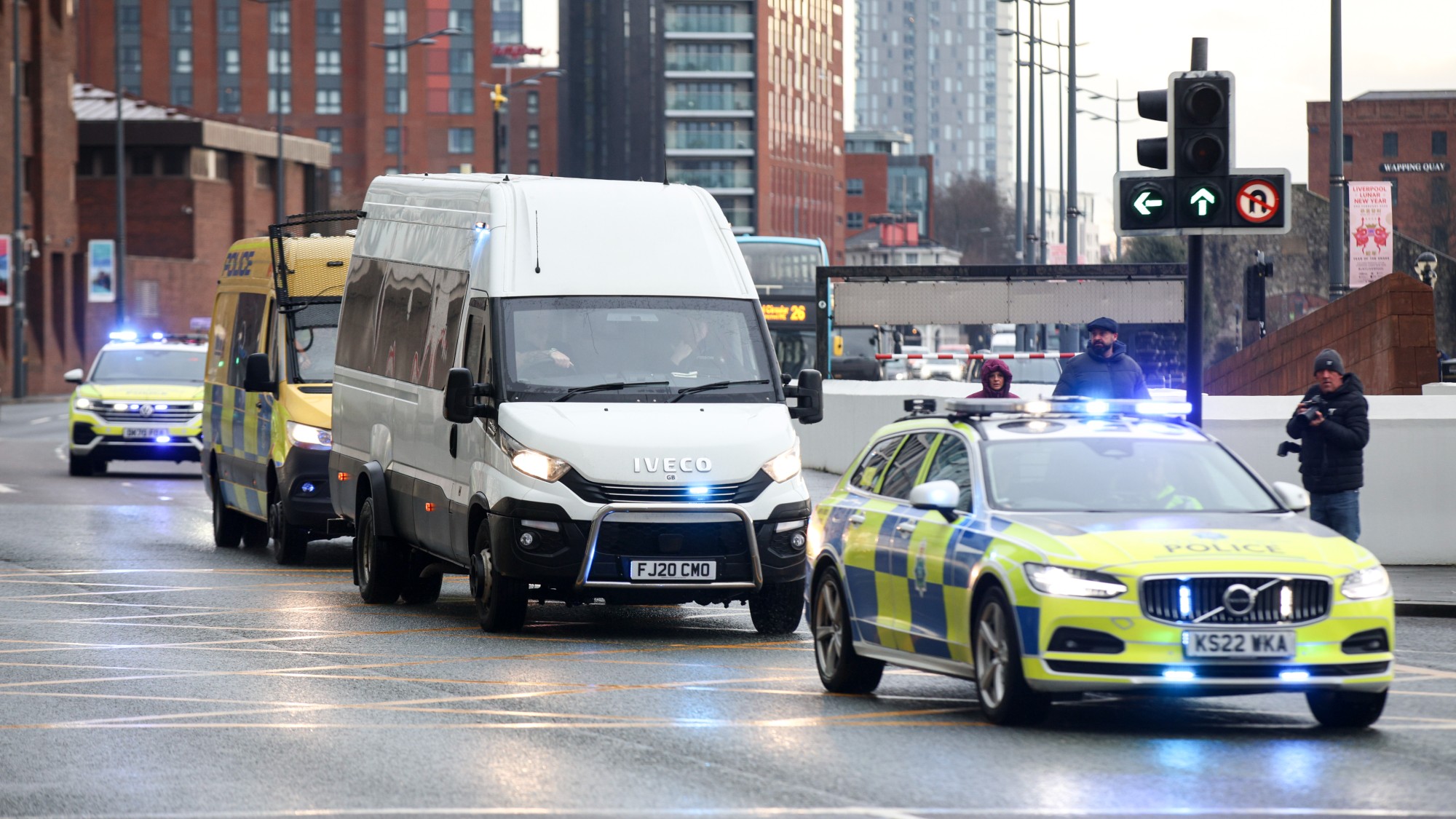 A line of police vehicles delivering/escorting Axel Rudakubana for sentencing in 2025