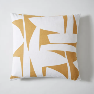 yellow and white patterned cushion cover