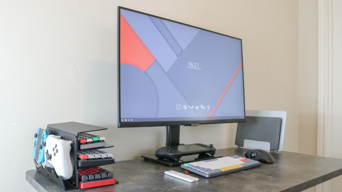 A side angle view of the keyboard storage rack on a desk