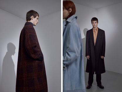 Models wear maroon and blue tailored coats by Ferragamo