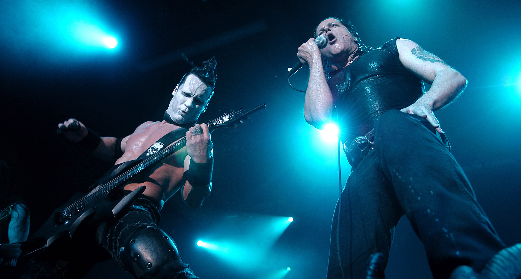 Doyle Wolfgang Von Frankentstein (left) and Glenn Danzig perform on a stage lit by cool-blue lights