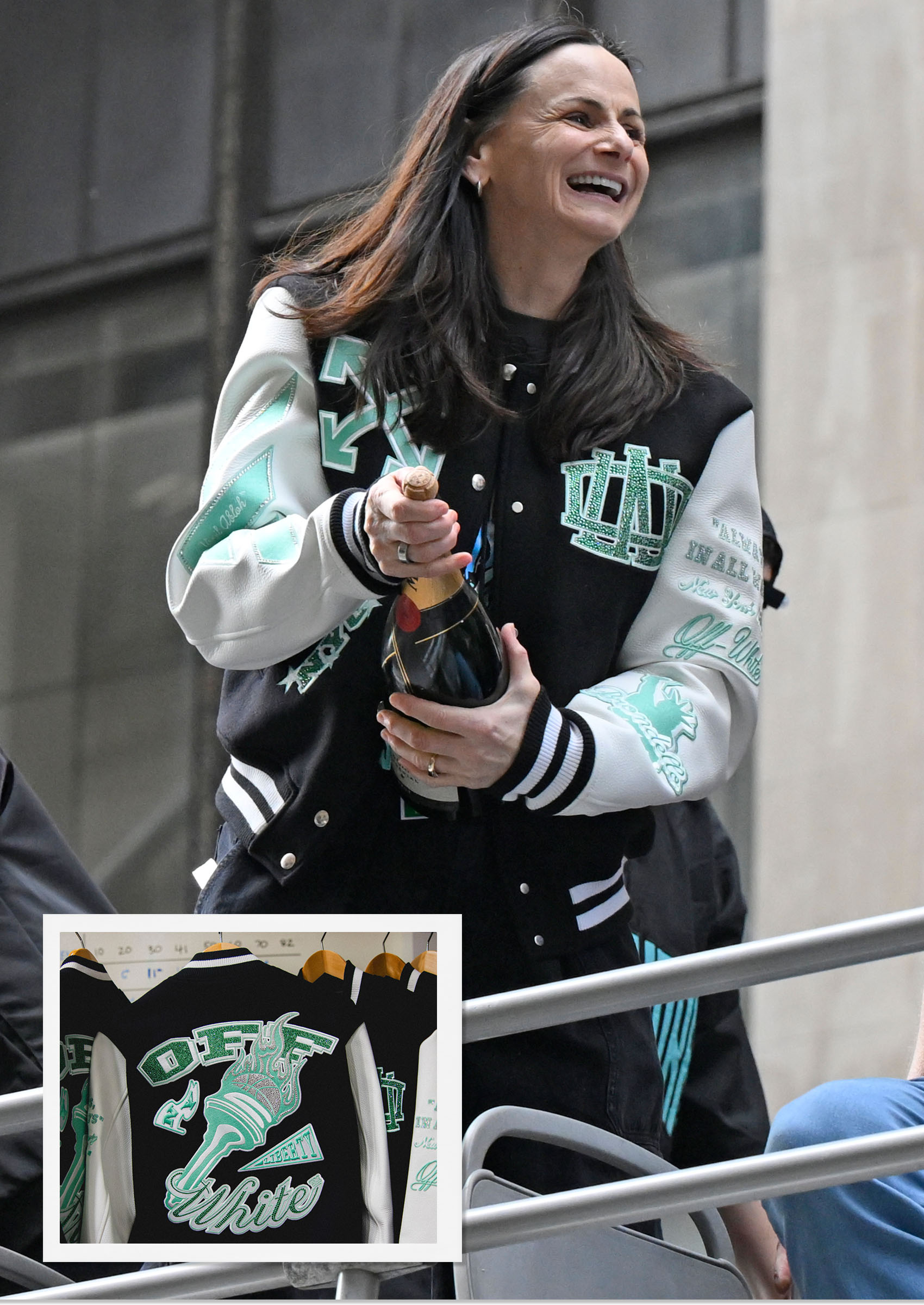 New York Liberty Head Coach Sandy Brondello in an Off White Liberty varsity jacket.